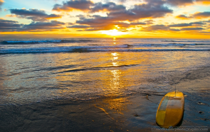 A Surfboard along the shore in Solana Beach.